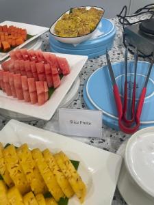a table with different types of food on plates at Agiva Hotel in Kurinci +31 photos