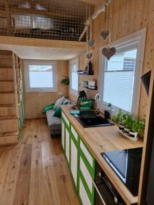 a kitchen with a counter top in a tiny house at Tiny House Reichle in Boms