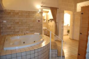 a large bathroom with a tub in a room at Antica Mateola in Matera +85 photos