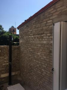 a brick wall next to a white door at Casa Andrean PT Lido Venezia in Venice-Lido +7 photos