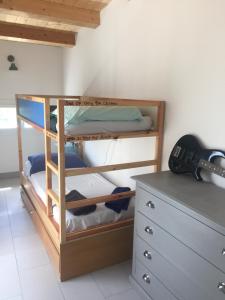 a bunk bed in a room next to a dresser at Casa Andrean PT Lido Venezia in Venice-Lido