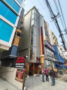 a group of people standing outside of a building at Mohar Residency Madhyamgram in kolkata