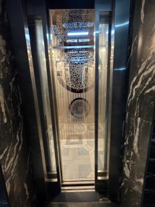 a view through a glass door of a building at Devlok Homes in Rishīkesh +117 photos