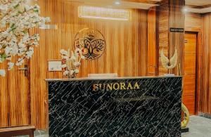a dressing room with a sign on the wall at Sunoraa Luxury Hotel & Spa in Mussoorie