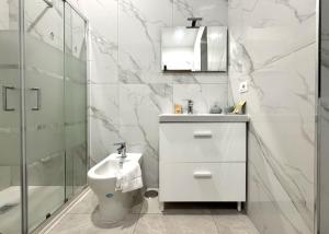 a bathroom with a sink and a toilet and a shower at Pompei Comfort Room in SantʼAntonio Abate +1 photo