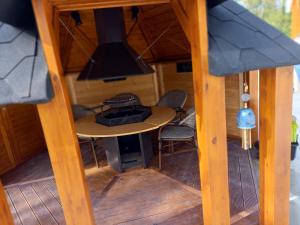 a view from the inside of a tiny house with a table at Lodge Mon Petit Lapin in Montgon