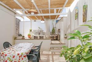 a dining room with a table and chairs at Casa Lucia in Specchia