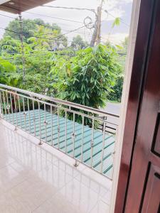 a balcony with a view of a pool at S70 Villa in Dickwella +3 photos
