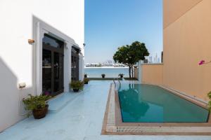 a swimming pool on the side of a building at Palm Jumeirah - Property Advisers in Dubai