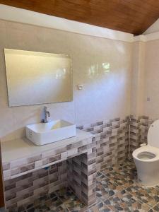 a bathroom with a sink and a toilet at TN House in Pai +11 photos