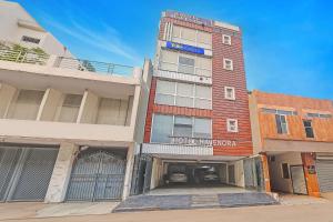 a building with a hotel with a sign on it at FabHotel Havenora - Nr Maharani Bagh in New Delhi