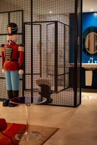 a toy soldier standing in front of a cage at Boutique Hotel Trieste - Adults Only in Verona
