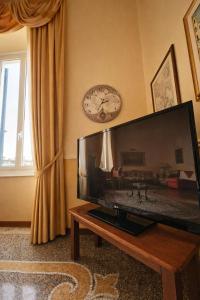 a living room with a large flat screen tv at Hotel Delle Rose in Rapallo