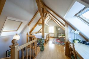 a attic bedroom with a bed and a staircase at Hotel Säntis - Genuss & Tradition in Appenzell +70 photos