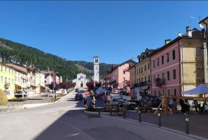 a street in a town with a clock tower at Hotel Monte Fior in Foza