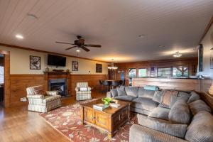 a living room with a couch and a table at Alpine Vista in Blowing Rock