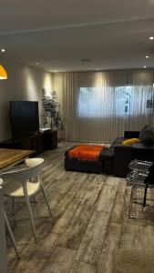a living room with a bed and a couch at Casa Azahares in Yerba Buena