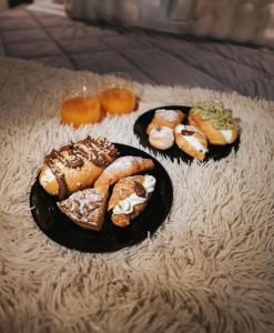 a group of pastries on plates on a table at Sweetlove Spa in Terracina +12 photos