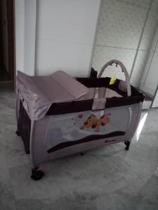 a baby bed in a room with at Le doux refuge 67 in Schwabwiller