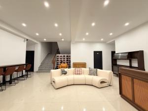a living room with a couch and a table at Damao Holiday shanghai pvg 24hFREE shuttle bus in Shanghai