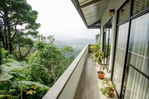 a balcony of a house with plants at Mystay in Kandy
