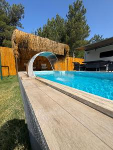 a swimming pool with a water fountain at Vadi Karavan Otel in Buca