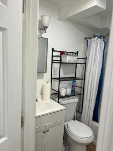 a bathroom with a toilet and a sink at Private 1BR with Parking & Laundry Near Boston in Everett