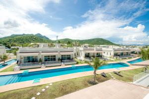 an aerial view of a resort with a swimming pool at Oriental Beach Pearl Resort in Sam Roi Yot