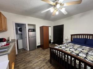 a bedroom with a bed and a ceiling fan at Malden Studio near Boston -- Private Stay with Kitchenette, Laundry in Malden