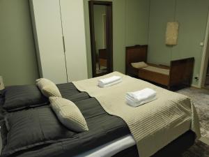 a bedroom with a bed with two towels on it at Raanu Apartment 45 minutes from Rovaniemi center in Raanujärvi
