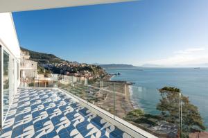 a view of the ocean from the balcony of a house at Laguna Blu in Vietri sul Mare