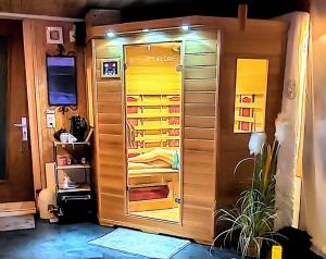 a room with a closet with a door open at La Schaumauna, privater Spa in Oberkirch