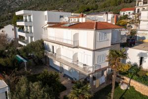 an aerial view of a white building with balconies at Apartments Klaricic in Živogošće