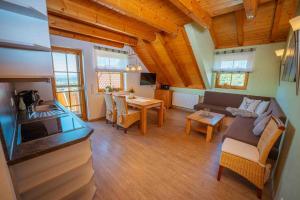 a living room with a couch and a table at Ferienhaus Bührer in Freiamt