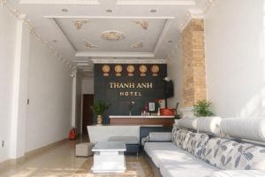 a living room with a couch and a table at Thanh Anh Hotel Da Lat in Da Lat