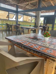 a table with a table cloth on top of it at Agbevivi Boutique Hôtel in Aného