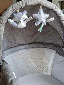 a bed with two stuffed stars on top of it at Oxi in Modena