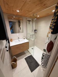a bathroom with a sink and a shower at Charming stone house in Eus - Vue sur les Montagnes & Confort 2025 in Eus +38 photos