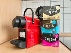 a toaster sitting on a counter next to a box of cookies at VAJAGIC 1 - Apartment 4 Pers, 60 qm, EG, Messe, Uni Klinik in Essen