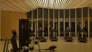 a gym with rows of chairs in a room at 2br Luxury apartment in Jakarta
