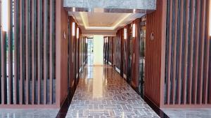 an empty hallway in a building with red walls and a hallwayngth at 2br Luxury apartment in Jakarta