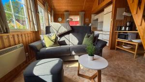 a living room with a couch and a table at Useriner Ferienhaus in Userin