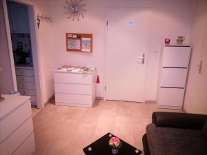 a living room with a refrigerator and a table at Ferienwohnung Dickes in Brandenburg an der Havel