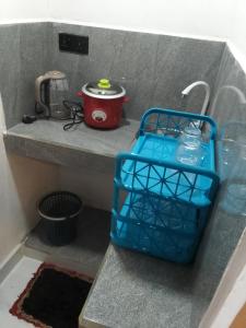 a blue basket sitting on top of a counter at Moonlight Resort in Anuradhapura