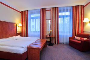 Postel nebo postele na pokoji v ubytování Hotel Concorde