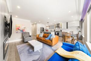 a living room with a couch and a table at 5 Bedroom Luxury Spa Escape with Pool & Jacuzzi in Toronto
