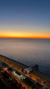 an aerial view of the ocean and a city at ASKO aprtament beach batumi in Batumi