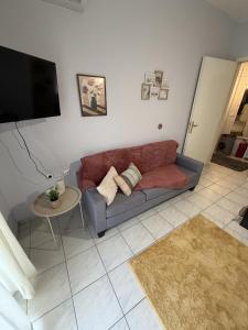 a living room with a couch and a table at Dimi's home in Komotini