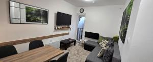 a living room with a couch and a table at Anikaapartmani, Brzeće in Brzeće +35 photos