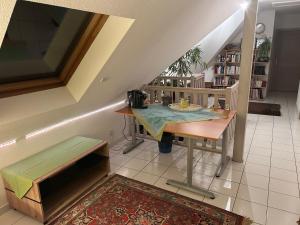 a room with a table and a table sidx sidx sidx at Chez Corinne et Michel in Saasenheim